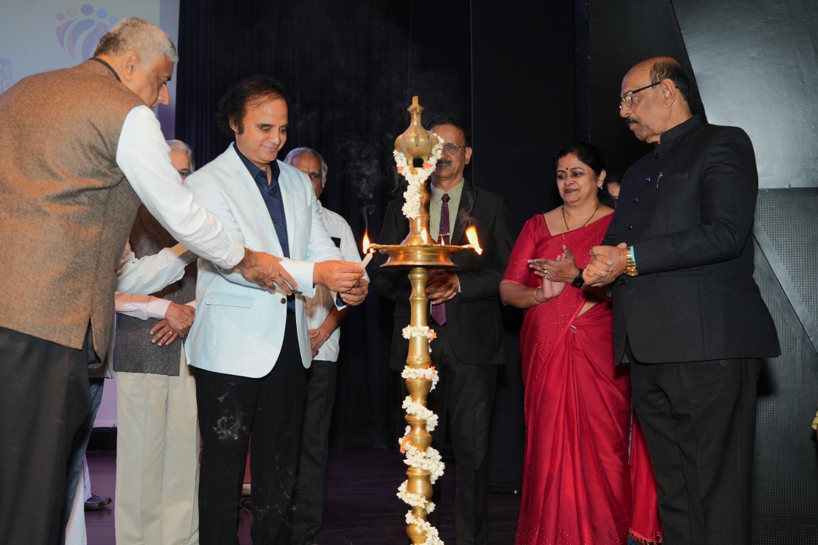 Education for Transformation Summit 2024 lamp lighting ceremony; Dr.Rajesh Palayil (second from left)