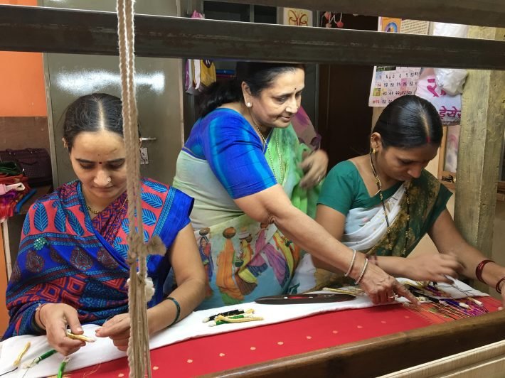 Asha Gautam with her women artisans in Paithan